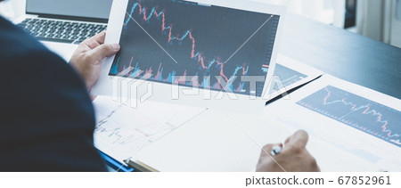 Trader businessmen analyze stock graph and report, Trader businessmen analyze stock graph and report, 67852961