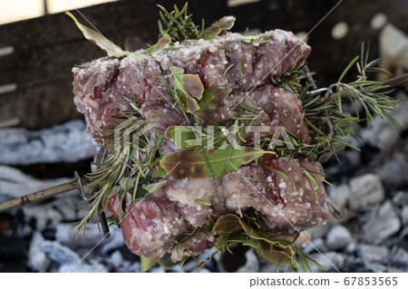 pork roast cooking on charcoal on barbecue pork roast cooking on charcoal on barbecue 67853565