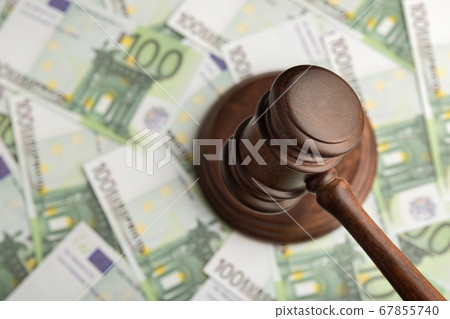 Judge hammer on Euro banknotes background. Judge Judge hammer on Euro banknotes background. Judge 67855740