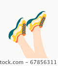 Female legs in the sneakers 67856311