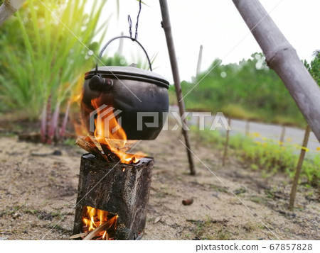 Outdoor camp fire and cooking 67857828