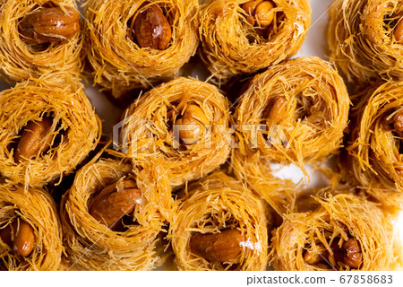 Arabic kadayif dessert with cashew nuts background 67858683