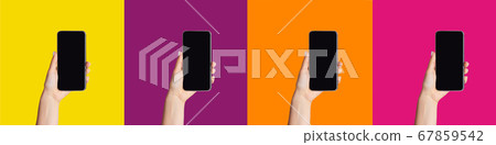 Young women showing cellphones with blank screens on colorful background, mockup for design Young women showing cellphones with blank screens on colorful background, mockup for design 67859542