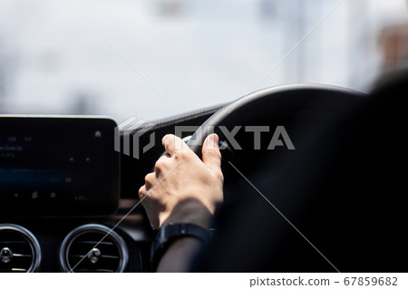 A young man driving a private car 67859682
