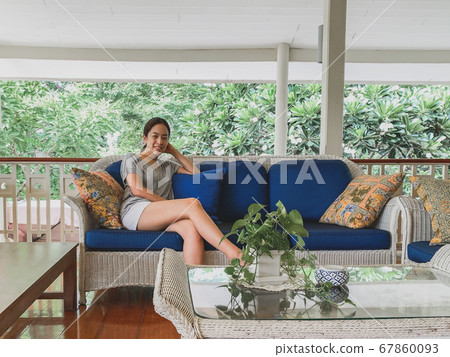Portrait beautiful asian women happy smiling sit on sofa. Portrait beautiful asian women happy smiling sit on sofa. 67860093