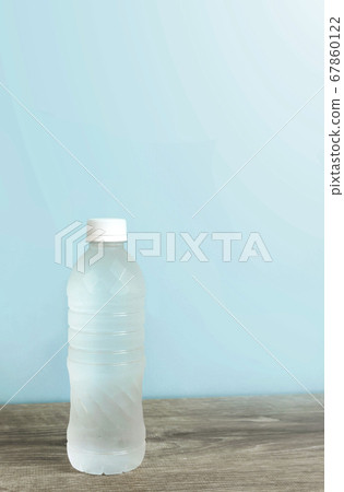Plastic bottle of water on the table Plastic bottle of water on the table 67860122