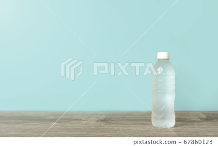 Plastic bottle of water on the table 67860123
