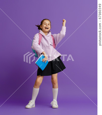 Kid with backpack on color background. 67860349