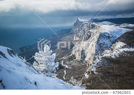 A frosty and sunny day is in mountains 67862801