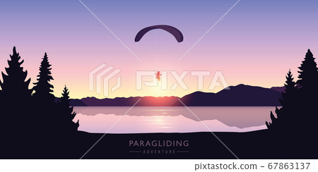paragliding adventure by the lake at beautiful sunrise 67863137
