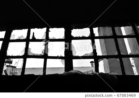 broken factory window 67863469