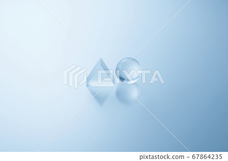 Triangular and spherical acrylic with a reflection 67864235