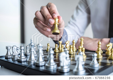 Gold and silver chess with player, Hands of Gold and silver chess with player, Hands of 67866198
