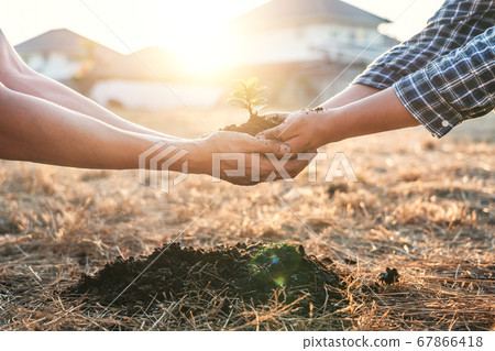 Environment earth day in hands, two people holding Environment earth day in hands, two people holding 67866418