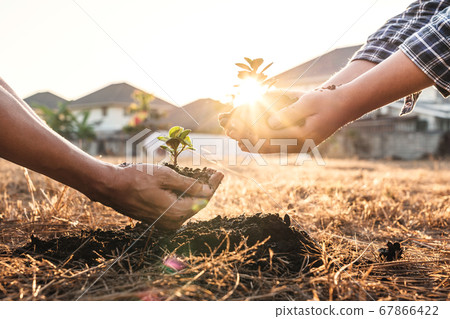 Environment earth day in hands, two people holding Environment earth day in hands, two people holding 67866422