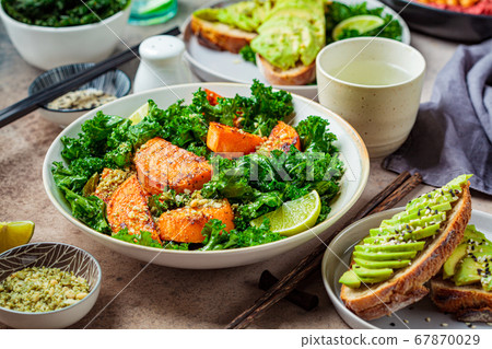 Vegan lunch table. Baked sweet potato salad  67870029