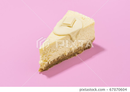 Cheesecake slice with white chocolate topping. One 67870604