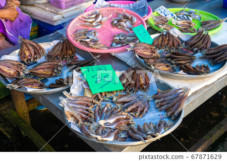 Fresh seafood on the counter at the fish market by Fresh seafood on the counter at the fish market by 67871629