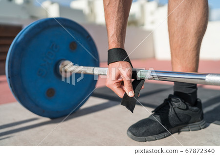 Weightlifting wrist straps fitness man Weightlifting wrist straps fitness man 67872340