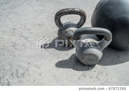 Gym kettlebell weights and medicine ball Gym kettlebell weights and medicine ball 67872388