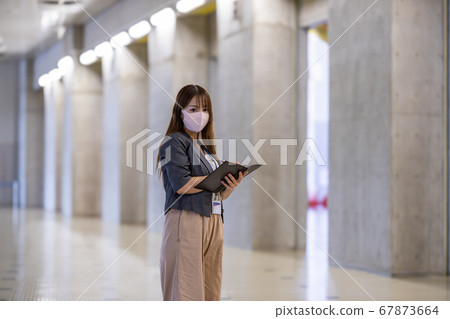 A woman who works for quality check 67873664