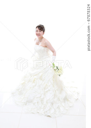 Bride and groom in a wedding dress and tuxedo photo wedding white background Bride and groom in a wedding dress and tuxedo photo wedding white background 67878324