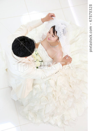Bride and groom photo wedding in wedding dress and tuxedo 67878328
