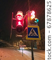 red traffic light lights up at night 67878625