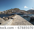 A ship staying at the port of Hydra island 67885070