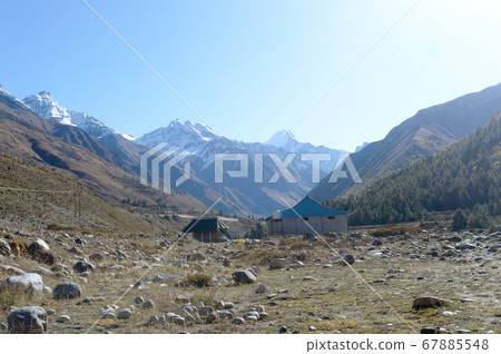 A mountain Alpine hut cabin in high Himalayas A mountain Alpine hut cabin in high Himalayas 67885548