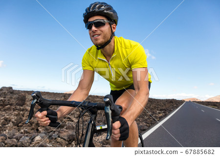 Cyclist riding road bike biking for triathlon Cyclist riding road bike biking for triathlon 67885682