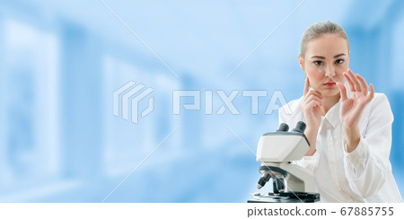 Scientist researcher uses microscope in laboratory 67885755