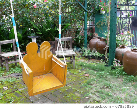 Cloudy view of a garden of a traditional house 67885859