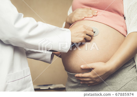 Pregnant Woman and Gynecologist Doctor at Hospital 67885974