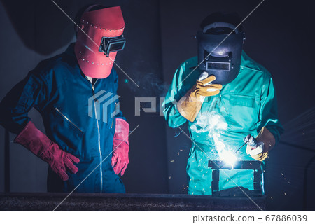 Metal welding steel works using electric arc welding machine Metal welding steel works using electric arc welding machine 67886039