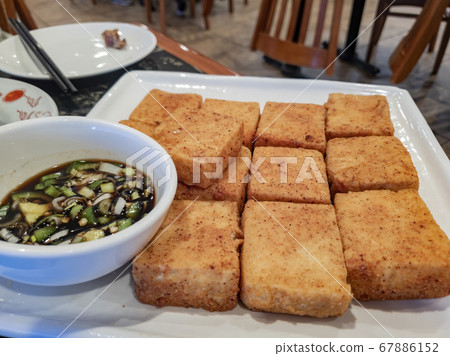 Close up shot of a plate of deep fried tofu Close up shot of a plate of deep fried tofu 67886152