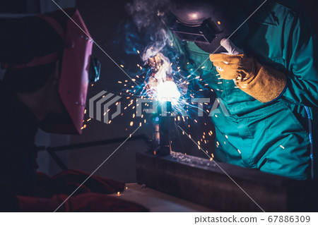 Metal welding steel works using electric arc welding machine Metal welding steel works using electric arc welding machine 67886309