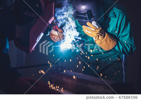 Metal welding steel works using electric arc welding machine 67886506