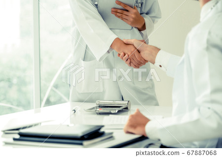 Doctors at hospital working with partner. Healthcare and medical services. Doctors at hospital working with partner. Healthcare and medical services. 67887068