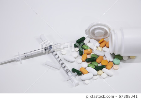 Various pills and syringes 67888341