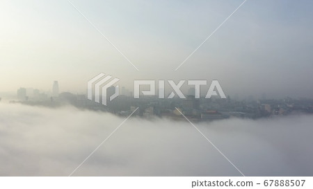 Aerial view of the city in the fog. Aerial view of the city in the fog. 67888507