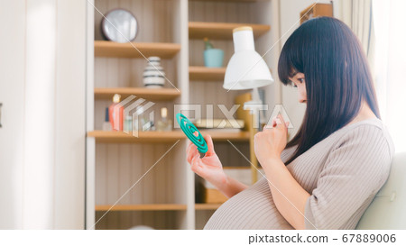 Mosquito coil incense pregnant woman doubts copy space 16:9 Mosquito coil incense pregnant woman doubts copy space 16:9 67889006