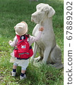 Dog figurines and children 67889202