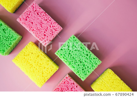 Cleaning sponges for washing dishes on pink background 67890424