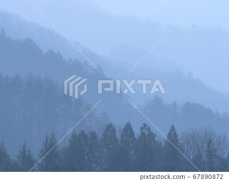 Mountains in the morning haze Mountains in the morning haze 67890872