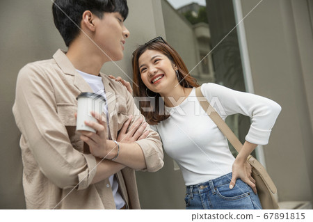 Couple walking around town Couple walking around town 67891815