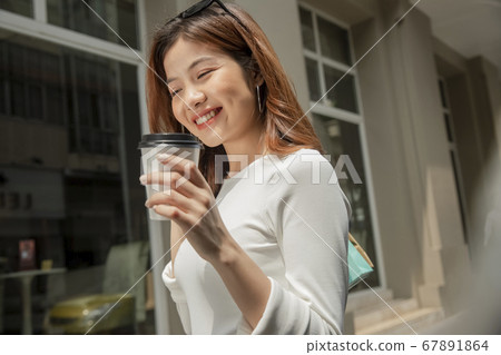Woman walking around town 67891864