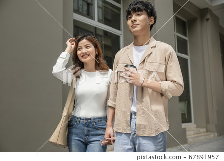 Couple walking around town Couple walking around town 67891957