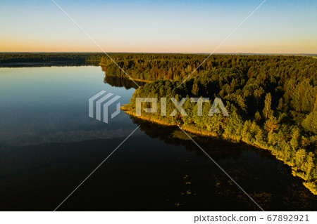 Top view of the lake Bolta in the forest in the Braslav lakes National Park, the most beautiful places in Belarus.An island in the lake.Belarus. 67892921