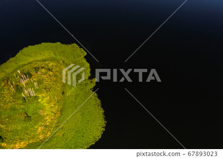 Top view of lake Drivyaty in the Braslav lakes National Park, the most beautiful lakes in Belarus.An island in the lake.Belarus. 67893023